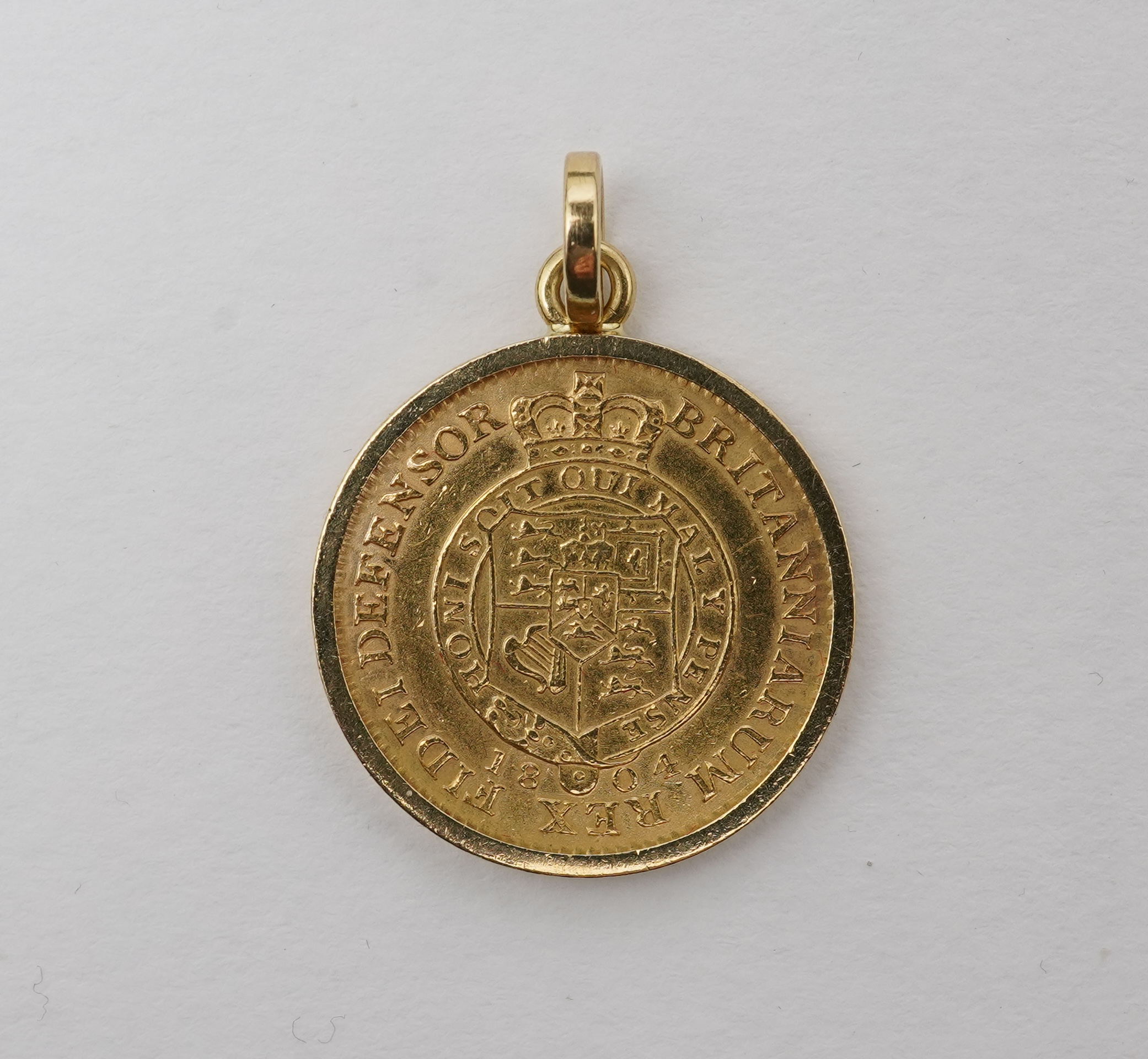 A George III half guinea pendant, circa 1804 and later